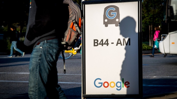 A pedestrian walks past a sign at Google Inc. headquarters in Mountain View, California, U.S., on Wednesday, April 25, 2018. Alphabet Inc. is pushing efforts to roll back the most comprehensive biometric privacy law in the U.S., even as the company and its peers face heightened scrutiny after the unauthorized sharing of data at Facebook Inc.