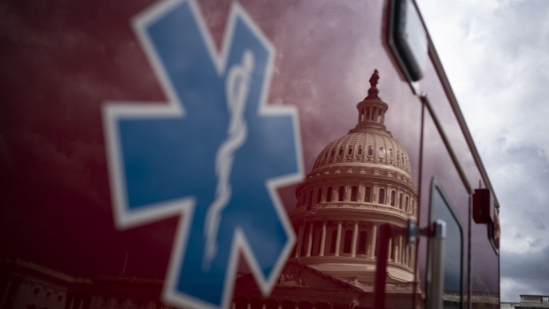 The U.S. Capitol is reflected on an ambulance in Washington, D.C., U.S., on Thursday, April 9, 2020. Photographer: Al Drago/Bloomberg