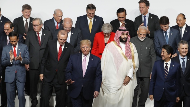Donald Trump poses for a group photo with world leaders