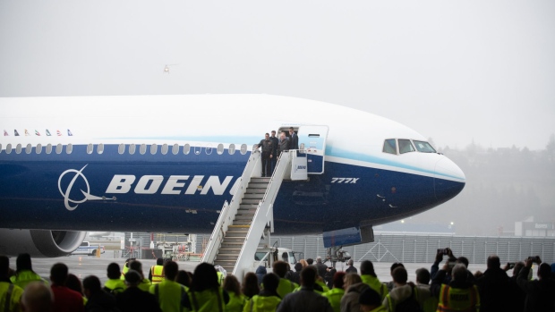 Pilots exit a Boeing 777X airplane in Seattle, Washington.