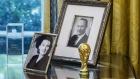 Photographs of U.S. President Donald Trump's parents, Mary Anne MacLeod Trump and Fred Trump, sit on a desk in the Oval Office at the White House in Washington, D.C. Photographer: Zach Gibson/Bloomberg