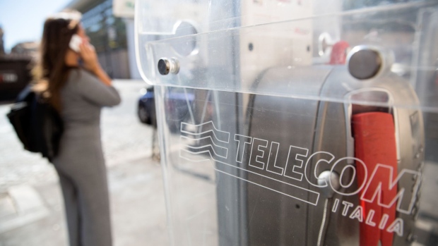 A logo sits on a fixed-line public telephone booth, operated by Telecom Italia SpA, in Rome, Italy, on Monday Sept. 25, 2017. Telecom Italia is considering another management shuffle that may see an Italian returning to a senior role at the country’s biggest phone carrier in a bid to head off punitive action by regulators in the country, people familiar with the matter said.