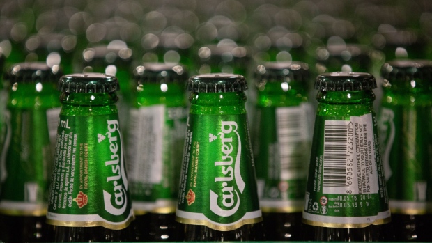 Green bottles of Carlsberg beer move along the production line following the labeling process at the Baltika Breweries LLC plant, operated by Carlsberg A/S, in Saint Petersburg, Russia, on Thursday, May 10, 2018. A slowdown in Russian demand for beer as international sanctions threaten the country's economy is weighing on Danish brewer Carlsberg's sales.