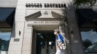A pedestrian wearing a protective mask walks past a Brooks Brothers store in Chevy Chase, Maryland, U.S., on Wednesday, July 7, 2020. Brooks Brothers Group Inc. filed for bankruptcy, felled by the coronavirus pandemic's impact on clothing sales and its own heavy debt load. Photographer: Alex Edelman/Bloomberg