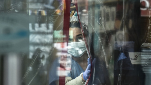 NEW YORK, NY - APRIL 1: A pharmacist works while wearing personal protective equipment in the Elmhurst neighborhood on April 1, 2020 in New York City. With more than 75,000 confirmed cases of COVID-19 and more than 1,000 deaths, New York City has become the epicenter of the outbreak in the United States. (Photo by Stephanie Keith/Getty Images)
