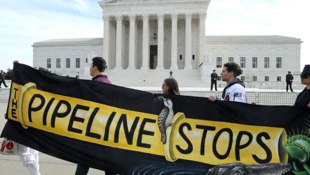 Climate activist groups protest in front of the U.S. Supreme Court in Washington as oral arguments are heard in U.S. Forest Service and Atlantic Coast Pipeline LLC v. Cowpasture River Preservation Association on Feb. 24.