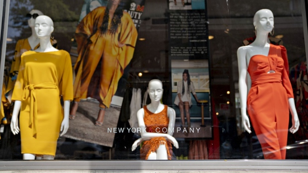 Mannequins stand on display inside a temporarily closed New York & Co. store in Silver Spring, Maryland on June 5. Photographer: Andrew Harrer/Bloomberg