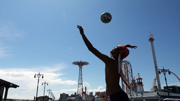 NEW YORK, NEW YORK - JULY 01: A teenager enjoys an afternoon at the beach at Brooklyn's Coney Island on the first day that swimming is allowed at New York City beaches on July 01, 2020 in New York City. Area beaches had been closed to swimming due to concerns of crowding at beaches and the risk of spread of the coronavirus. (Photo by Spencer Platt/Getty Images)