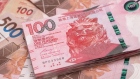 Hong Kong five-hundred and one-hundred dollar banknotes are arranged for a photograph in Hong Kong, China, on Thursday, April 23, 2020. Photographer: Paul Yeung/Bloomberg