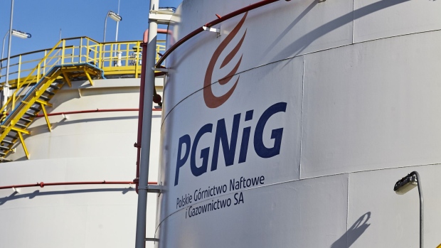 A logo sits on an oil storage tank at the natural gas and crude oil mine operated by Polskie Gornictwo Naftowe i Gazownictwo SA, also known as PGNiG, in Grotow, Poland, on Friday, Feb. 23, 2018. Poland, which relies on Kremlin-controlled Gazprom PJSC for about two-thirds of its gas, says diversification trumps potential price cuts it could leverage from building an import link to access Norwegian fuel. Photographer: Bartek Sadowski/Bloomberg