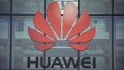 A Huawei Technologies Co. logo hangs above the entrance to the company's offices in Reading, U.K., on Monday, July 13, 2020. 