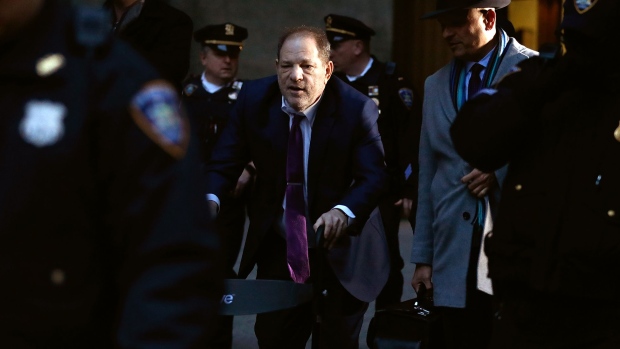 Harvey Weinstein, center, departs from state supreme court in New York on Jan. 27. Photographer: Peter Foley/Bloomberg