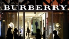 Pedestrians walk past a Burberry Group Plc store in the Omotesando district of Tokyo.