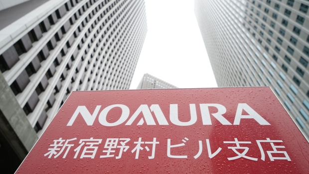 Signage for a branch of Nomura Securities Co. Photographer: Kentaro Takahashi/Bloomberg