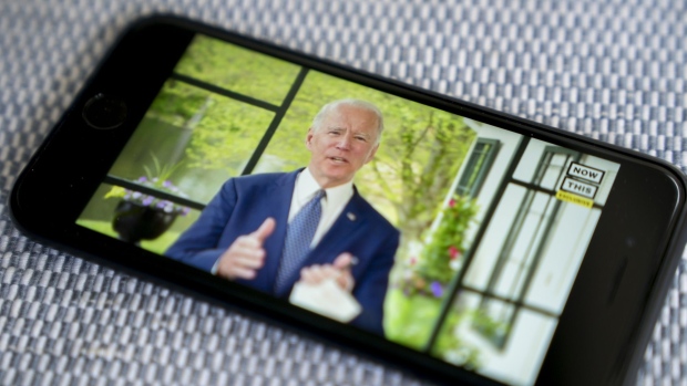 Former Vice President Joe Biden, presumptive Democratic presidential nominee, speaks during a NowThis economic address seen on a smartphone in Arlington, Virginia, U.S., on Friday, May 8, 2020. A super political action committee backing Joe Biden will launch a $10 million television ad campaign touting the presumptive Democratic nominee's leadership on the economic recovery after the 2008 financial crisis.