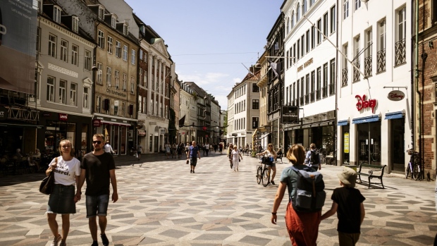 Pedestrians walk along a pedestrianized shopping street in Copenhagen, Denmark on Tuesday, June, 16, 2020. Denmark's central bank warned of the risk of a slow recovery from the historic recession triggered by Covid-19. Photographer: Carsten Snejbjerg/Bloomberg