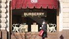 A shopper wearing a protective face mask walks past a Burberry Group Plc luxury fashion store in Moscow, Russia, on Thursday, March 26, 2020. With the extent of Russia’s coronavirus epidemic distorted by a lack of testing, Moscow Mayor Sergey Sobyanin ordered restaurants and most stores in Europe’s biggest city to shut down for a week.