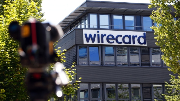 A television news camera stands outside the Wirecard AG headquarters during a police and prosecutors raid in Munich, Germany, on Wednesday, July 1, 2020. Wirecard offices in Germany and two locations in Austria were raided by Munich prosecutors looking into the 1.9 billion euros ($2.1 billion) that went missing from the fintech company’s accounts.