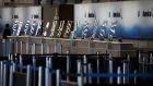Protective plastic shields stands at an empty ticket check-in counter in the American Airlines Group Inc. area at O'Hare International Airport (ORD) in Chicago, Illinois, U.S., on Saturday, June 13, 2020. The market for jet fuel, along with an increase in flight bookings since early May, is signaling that at least some Americans are ready to take to the skies again after foregoing the pleasures of travel. Photographer: Patrick T. Fallon/Bloomberg