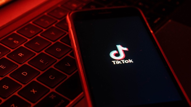 The logo for ByteDance Ltd.'s TikTok app is arranged for a photograph on a smartphone in Hong Kong, China, on Tuesday, July 7, 2020. TikTok, which has Chinese owners, announced it would pull its viral video app from Hong Kong's mobile stores in the coming days even as President Donald Trump threatened to ban it in the U.S. Photographer: Lam Yik/Bloomberg