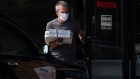 A customer wearing a protective mask exits a Domino's Pizza Inc. restaurant in Southfield, Michigan, U.S., on Thursday, July 9, 2020. Domino’s is scheduled to release earnings figures on July 16. Photographer: Emily Elconin/Bloomberg
