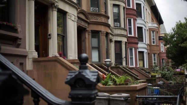 Brownstone buildings line a street of the Bedford-Stuyvesant neighborhood in the Brooklyn borough of New York.