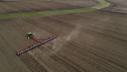 A tractor planting corn seed in a field in Illinois, U.S. Bloomberg/Daniel Acker