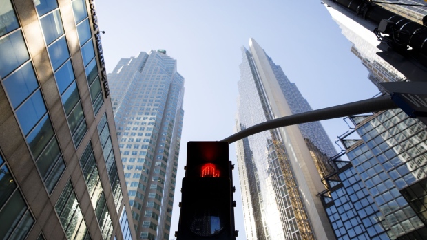 A crosswalk sign flashes red in the financial district of Toronto, Ontario, Canada, on Friday, May 22, 2020. 