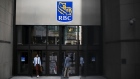 People enter and exit from the Royal Bank of Canada (RBC) headquarters in the financial district of Toronto, Ontario, Canada, on Thursday, July 25, 2019. Canadian stocks fell as tech heavyweight Shopify Inc. weighed on the benchmark and investors continued to flee pot companies.