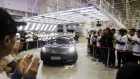 A Tesla Inc. Model 3 vehicle set to be delivered to a company employee moves off an assembly line during a ceremony at the company's Gigafactory in Shanghai, China, on Monday, Dec. 30, 2019. Tesla delivered its first China-built cars today, a milestone for Elon Musk's company as it accelerates a push in the world's largest electric-vehicle market. Photographer: Qilai Shen/Bloomberg