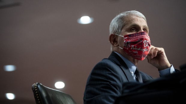 Anthony Fauci, director of the National Institute of Allergy and Infectious Diseases, wears a Washington Nationals protective mask while listening during a Senate Health, Education, Labor and Pensions Committee hearing in Washington, D.C., U.S., on Tuesday, June 30, 2020. The U.S. government's top infectious disease specialist said he's "quite concerned" about the spike in cronavirus cases in Florida, Texas, Arizona and California.