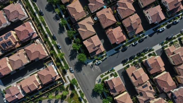Homes stand in a planned residential community in this aerial photograph taken over Irvine, California, U.S., on Wednesday, May 6, 2020. Mounting economic fallout from the pandemic is fueling apartment landlords' concerns that more tenants will struggle to make their rent payments, even after most managed to come up with the money for April.