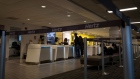 An employee assists customers at the Hertz Global Holdings Inc. rental counter at San Francisco International Airport in San Francisco, California, U.S., on Tuesday, May 5, 2020. Hertz Global Holdings said it entered into forbearances and limited waivers with certain of the Company's corporate lenders and holders of the company’s asset-backed vehicle debt. Photographer: David Paul Morris/Bloomberg
