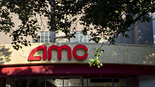 A pedestrian walks near an AMC Entertainment Holdings Inc. movie theater in Arlington, Virginia, U.S., on Monday, June 8, 2020. AMC is expected to release earnings figures on June 9. Photographer: Andrew Harrer/Bloomberg