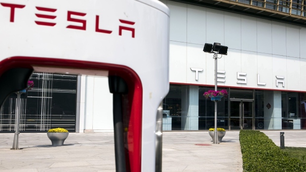 The Tesla Inc. logo is displayed outside one of the company's showrooms in Beijing, China, on Friday, May 10, 2019.