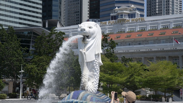 The Merlion Statue stands by Marina Bay in a near-empty Merlion Park in Singapore on Monday, July 6, 2020. Prime Minister Lee Hsien Loong vowed to hand over Singapore “intact” and in “good working order” to the next generation of leaders, predicting the coronavirus crisis will “weigh heavily” on the nation’s economy for at least a year.