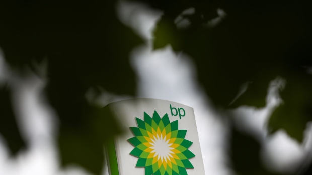 A BP Plc logo sits at the top of a totem sign at a filling station in London, U.K., on Monday, June 8, 2020. BP Plc plans to cut 10,000 jobs as the coronavirus pandemic accelerates the company's move to slim down for the energy transition. Photographer: Simon Dawson/Bloomberg