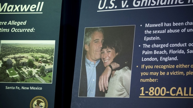 A photograph of Ghislaine Maxwell and Jeffrey Epstein is displayed during a news conference at the U.S. Attorney's Office in New York on July 2, 2020.