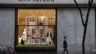 NEW YORK, NY - MAY 18: People pass the window display of an Ann Taylor women's clothing store in Manhattan on May 18, 2015 in New York City. Ascena Retail Group which owns Lane Bryant and Dressbarn, announced it is purchasing Ann Taylor and Loft retail stores for $2.16 billion to expand its women's apparel business. (Photo by Andrew Burton/Getty Images)