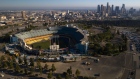 Dodger Stadium stands in this aerial photograph taken over Los Angeles, California, U.S., on Wednesday, May 27, 2020. Hertz Global Holdings Inc. will sell as many of its rental cars as possible while in bankruptcy to bring its huge fleet in line with reduced future demand in a post-pandemic economy, the company's lead bankruptcy lawyer said during a court hearing Wednesday.