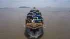 The Kota Cepat vessel loaded with shipping containers approaches the Yangshan Deepwater Port in this aerial photograph taken in Shanghai, China, on Sunday, July 12, 2020. U.S. President Donald Trump said Friday a phase two trade deal with China isn't under consideration, saying the relationship between Washington and Beijing has deteriorated too much.