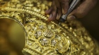 A worker labors on a six kilogram gold crown ahead of the Ganesh Chaturthi festival at a P.N. Gadgil Jewellers Pvt. workshop in Pune, India, on Monday, Aug. 17, 2017. About three quarters of the estimated $45 billion of the precious metal that is traded in the country each year makes its way through thousands of family-run jewelry shops that have catered for centuries to the nation's love of gold.