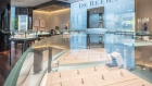 Diamond jewelry is displayed in cabinets inside a De Beers SA store in Hong Kong, China, on Thursday