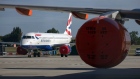 A passenger aircraft, operated by British Airways, a unit of International Consolidated Airlines Group SA (IAG), stands on the tarmac at London Southend Airport, part of the Stobart Group Ltd., in Southend-on-Sea, U.K., on Tuesday, July 7, 2020. EasyJet Plc plans to shutdown bases in Stansted, Southend and Newcastle in the U.K. Photographer: Chris Ratcliffe/Bloomberg