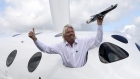 Richard Branson with a model of the LauncherOne rocket from the window of Virgin Galactic’s SpaceShipTwo at the Farnborough International Air Show in the U.K. in 2012. Photographer: Bloomberg
