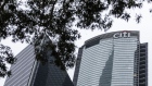 The Citigroup Inc. logo is displayed atop the Champion Tower, right, in Hong Kong, China, on Saturday, March 23, 2019. Citigroup, the global investment bank with a major presence in Asia, has ousted eight equities traders in Hong Kong and suspended three others after a sweeping internal investigation into its dealings with some clients, people familiar with the matter said. Photographer: Justin Chin/Bloomberg