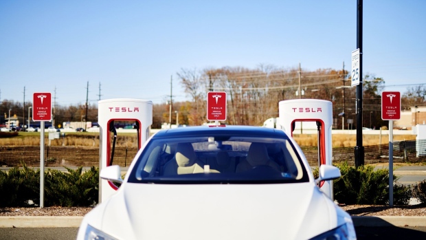 A Tesla Inc. electric vehicle sits parked in front of a charging station, part of the Main Street North Brunswick development project, in North Brunswick, New Jersey, U.S., on Wednesday, Nov. 13, 2019. 