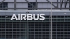 An Airbus SE logo sits on the company's aircraft assebly factory in Hamburg, Germany, on Wednesday, May 13, 2020. Airbus secured just nine net orders in April and delivered 14 jetliners after airlines desperate for cash put off accepting new planes and clamped down on spending to deal with a crisis that could last several years. Photographer: Krisztian Bocsi/Bloomberg