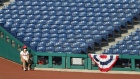 The right field ball girl sits during a Philadelphia Phillies game on July 25.