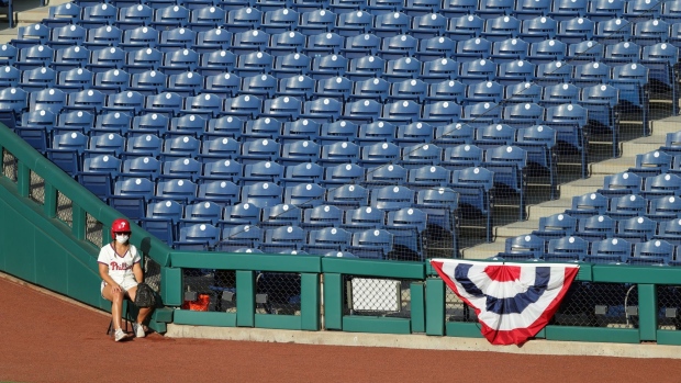 The right field ball girl sits during a Philadelphia Phillies game on July 25.